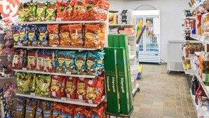 A grocery store aisle with snack bags and a green box on a cart. - 9 Person Holiday Park Home in Otterup (Otterup)