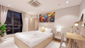 A modern bedroom with a bed, bedside table, desk, and a large window. - Cubicity Hidden House (Ho Chi Minh City)