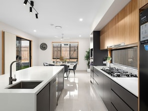Fridge, microwave, oven, stovetop - Spacious Modern 6BR Family Home in Pallara QLD (Pallara)