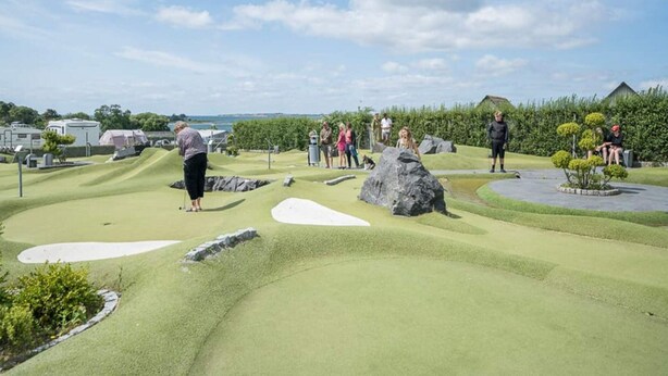 A miniature golf course with a clear sky and a few people playing. - 6 Person Holiday Park Home in Faaborg (Faaborg)