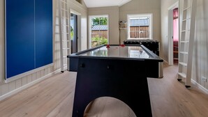 A spacious room with a pool table, wooden flooring, and a view of the outdoors. - "Adia" - 650m from the sea by Interhome (Ebeltoft)