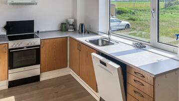 Coffee/tea maker, fridge, stovetop, dishwasher