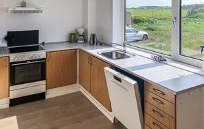 Fridge, stovetop, dishwasher, coffee/tea maker