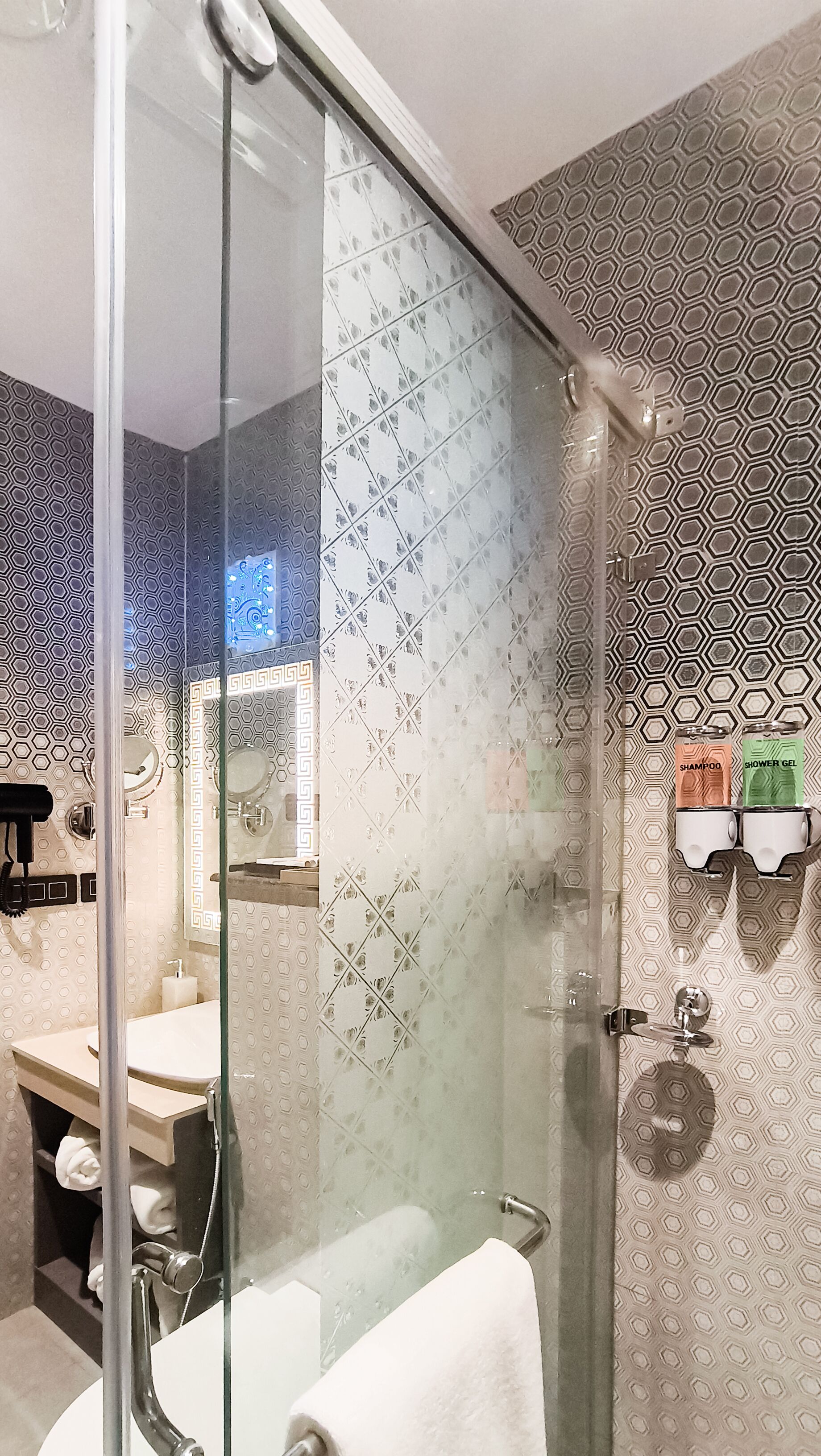 Shower, hair dryer, slippers, towels