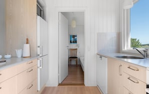 Fridge, stovetop, dishwasher, coffee/tea maker