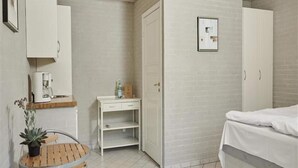 A compact bedroom with a bed, a desk, and a chair. - 2 Person Holiday Park Home in Graested (Graested)
