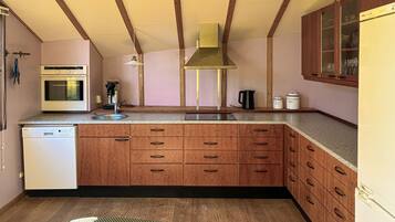 Fridge, stovetop, dishwasher, coffee/tea maker