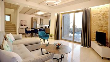 Villa, Sea View | Living area | 40-inch Smart TV with satellite channels