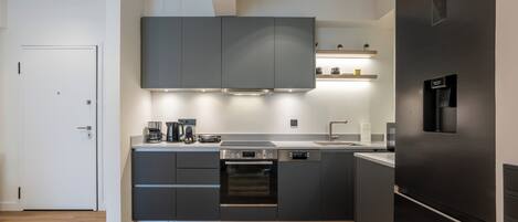 Deluxe Apartment, Balcony, City View | Private kitchen | Full-size fridge, microwave, oven, stovetop