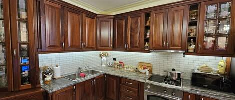 Fridge, microwave, stovetop, coffee/tea maker
