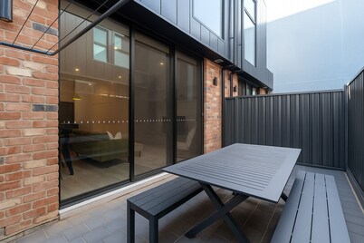 Stylish 3BR | Free Parking & Desk | Minutes to CBD and Walk to Plant 4