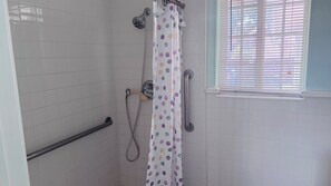 Shower, towels, soap, toilet paper