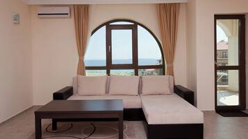 Apartment, 1 Bedroom | Living area | Flat-screen TV