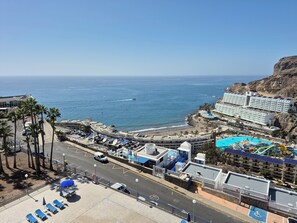 A coastal hotel with a pool, beach access, and a view of the ocean. - Tranquility and view in Taurito Luxholidays (Taurito)