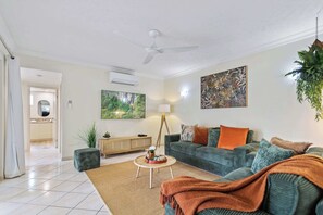 TV, offices - Stylish Lakeside Apartment w/ Spa Bath & Pool View (Cairns North)