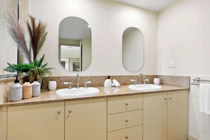 Shower, hair dryer, towels, shampoo