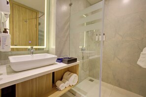 Club Room | Bathroom | Shower, hair dryer, slippers, soap - Cygnett Inn Dibrugrah (Dibrugarh)