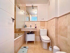 Bidet, towels, soap, toilet paper