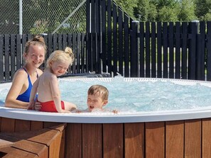 A wooden deck with a hot tub. - 6 Person Holiday Park Home in Malling (Malling)
