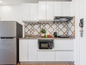 Fridge, microwave, electric kettle, cookware/dishes/utensils