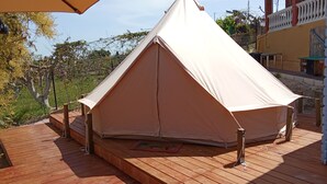 A tent set up on a wooden deck with a view of a building in the background. - Cozy campground in beautiful Salobrena with WiFi, AC (Salobrena)