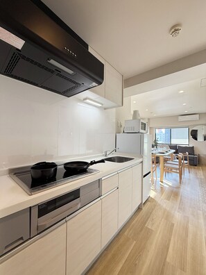 Luxury Apartment | Private kitchen | Fridge, microwave, stovetop, electric kettle