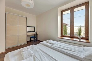 1 bedroom, desk, iron/ironing board, travel crib