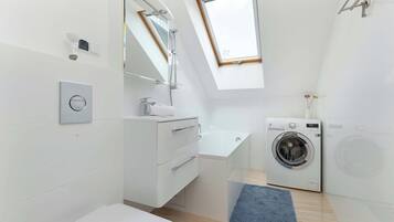 Shower, hair dryer, towels, shampoo
