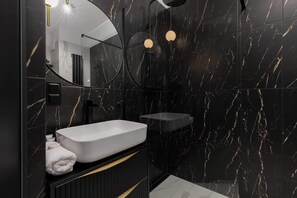 Shower, hair dryer, towels, shampoo