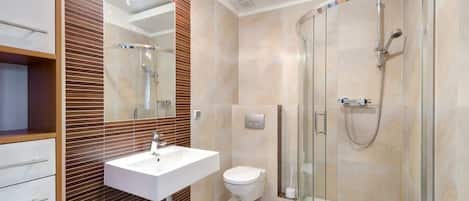 Shower, hair dryer, towels, shampoo