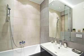 Shower, hair dryer, towels, shampoo
