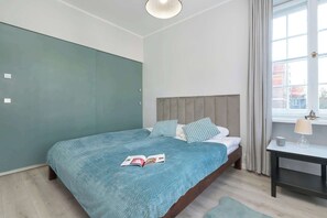 1 bedroom, desk, iron/ironing board, travel crib
