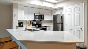 Fridge, microwave, oven, stovetop - Landing | Chic 2BD, Gym (Orlando)