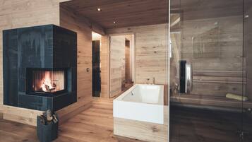 Deluxe Suite, 1 Double Bed with Sofa bed | Living area | 75-inch LED TV with cable channels, heated floors