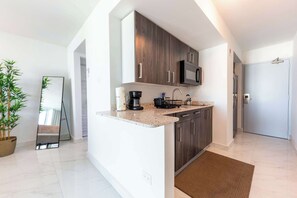 Fridge, microwave, stovetop, coffee/tea maker