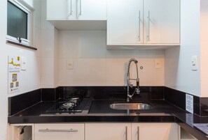 Fridge, microwave, stovetop, coffee/tea maker