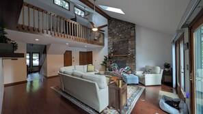 Smart TV, fireplace, books, stereo