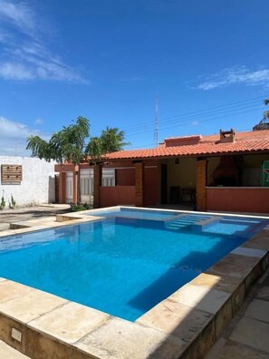 Outdoor pool, open 8:00 AM to 9:00 PM, pool umbrellas
