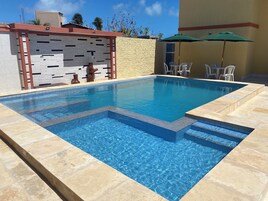 Outdoor pool, open 8:00 AM to 9:00 PM, pool umbrellas