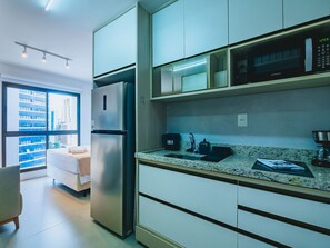 Fridge, microwave, cookware/dishes/utensils