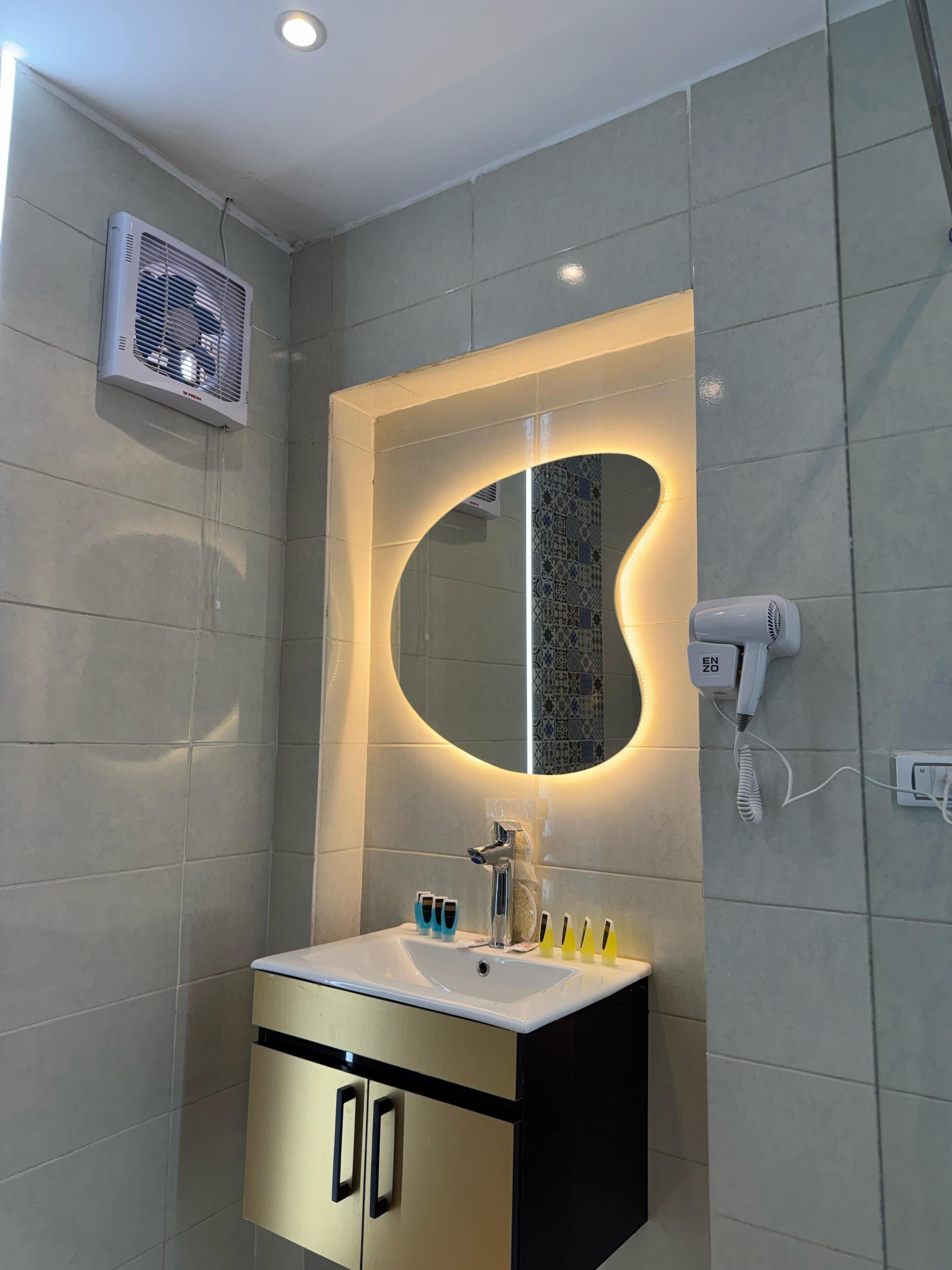 Family Quadruple Room | Bathroom | Shower, hair dryer, slippers, towels