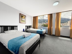Desk, laptop workspace, free WiFi, bed sheets