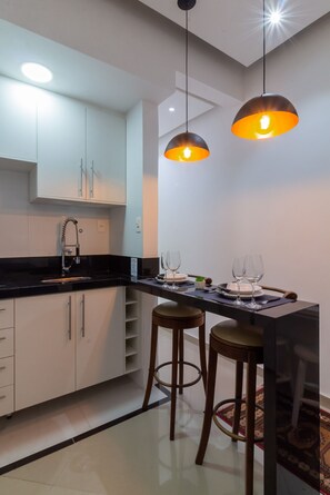 Fridge, microwave, stovetop, coffee/tea maker