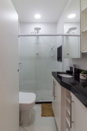 Shower, hair dryer, towels, shampoo