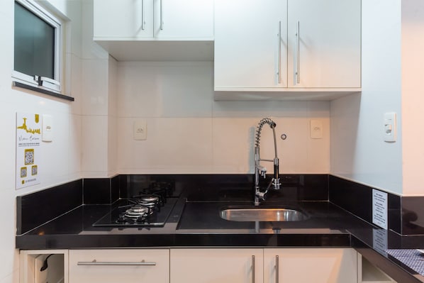 Fridge, microwave, stovetop, coffee/tea maker