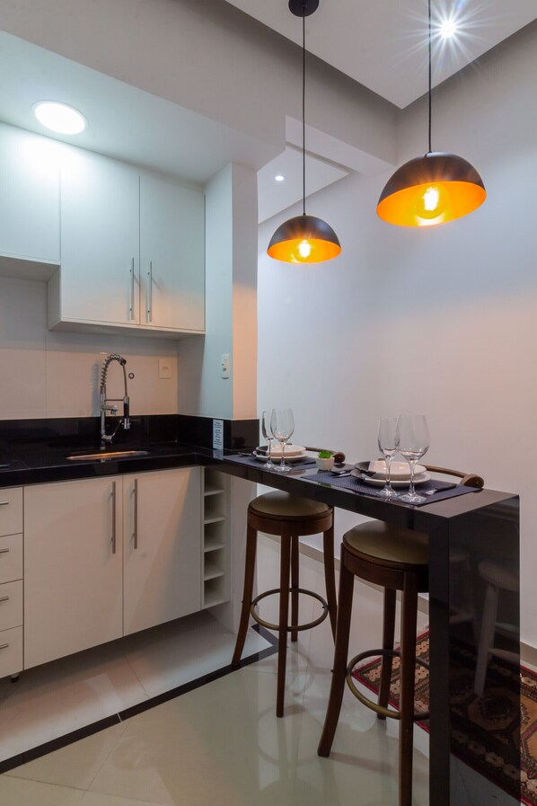 Fridge, microwave, stovetop, coffee/tea maker