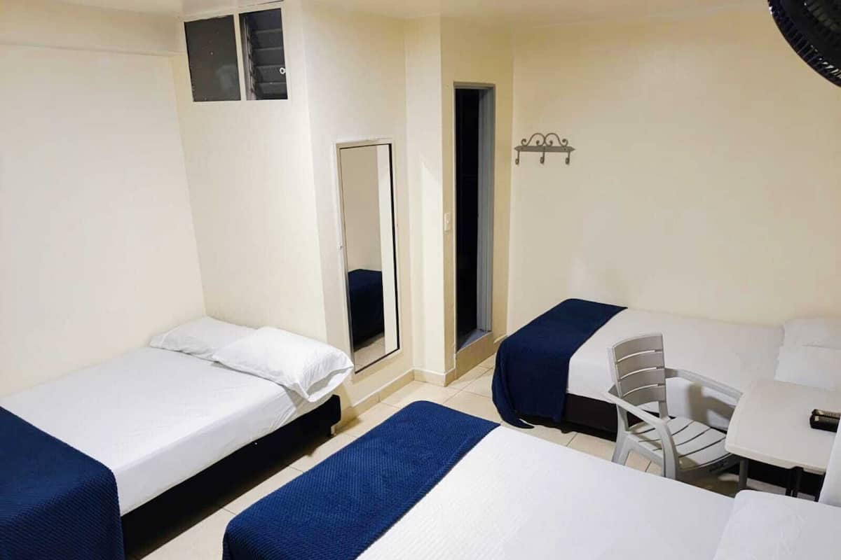 Classic Quadruple Room | Desk, blackout drapes, iron/ironing board, free WiFi