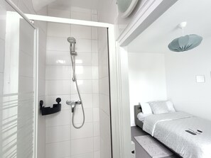 Shower, towels, soap, toilet paper