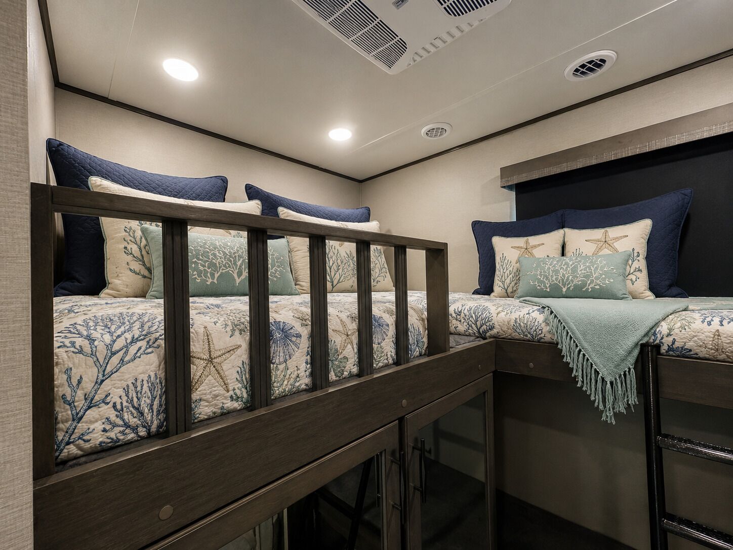 A bunk bed with a wooden frame and a headboard with a starfish design.
