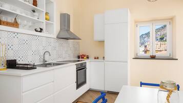 Panoramic Apartment, Sea View | Private kitchen | Fridge, oven, stovetop, espresso maker